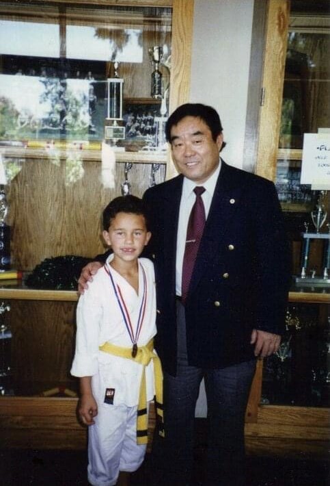 Jared as a young karate student with Grandmaster Fumio Demura